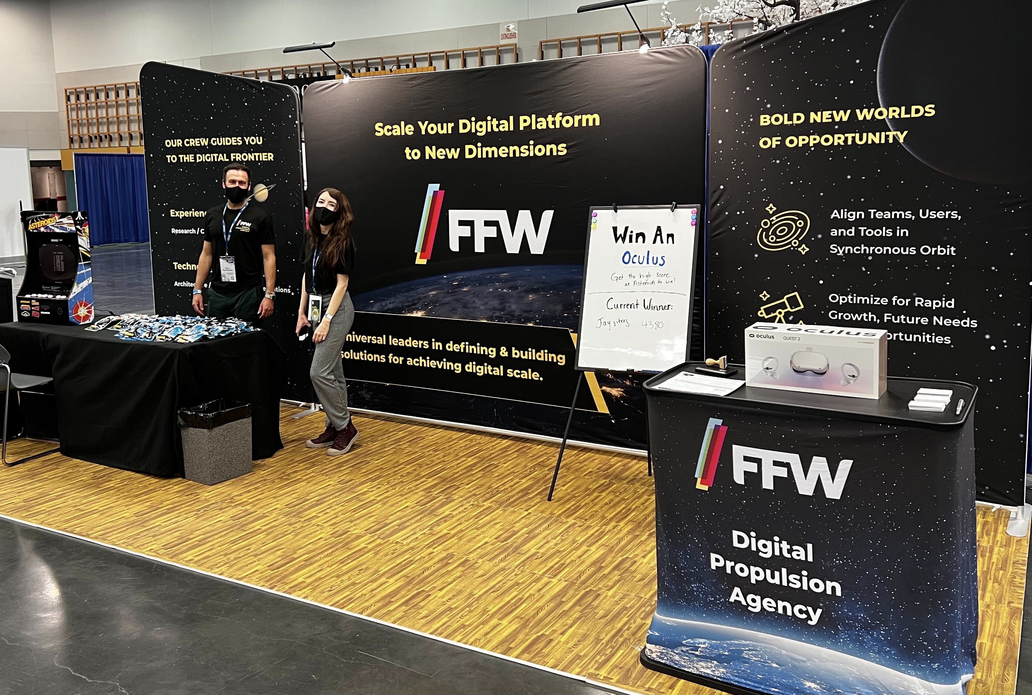 Image of FFW employees in front of our DrupalCon booth